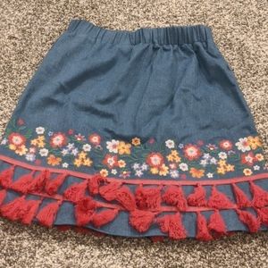 Cute embroidered denim mini skirt with tassels